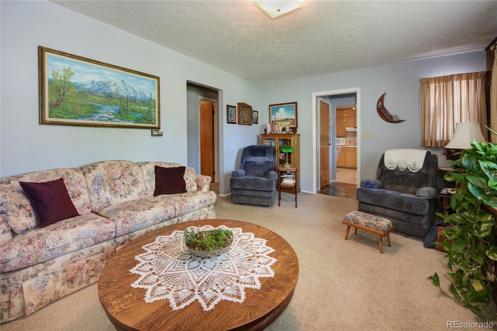4405 Agate Road Boulder, CO 80304 - Photo 11 of 40 a living room with furniture and a lamp