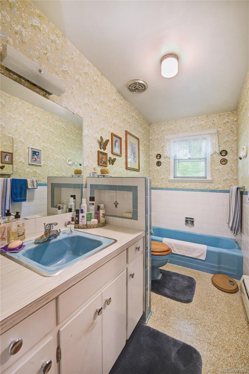 4405 Agate Road Boulder, CO 80304 - Photo 12 of 40 a kitchen with a sink stove and cabinets