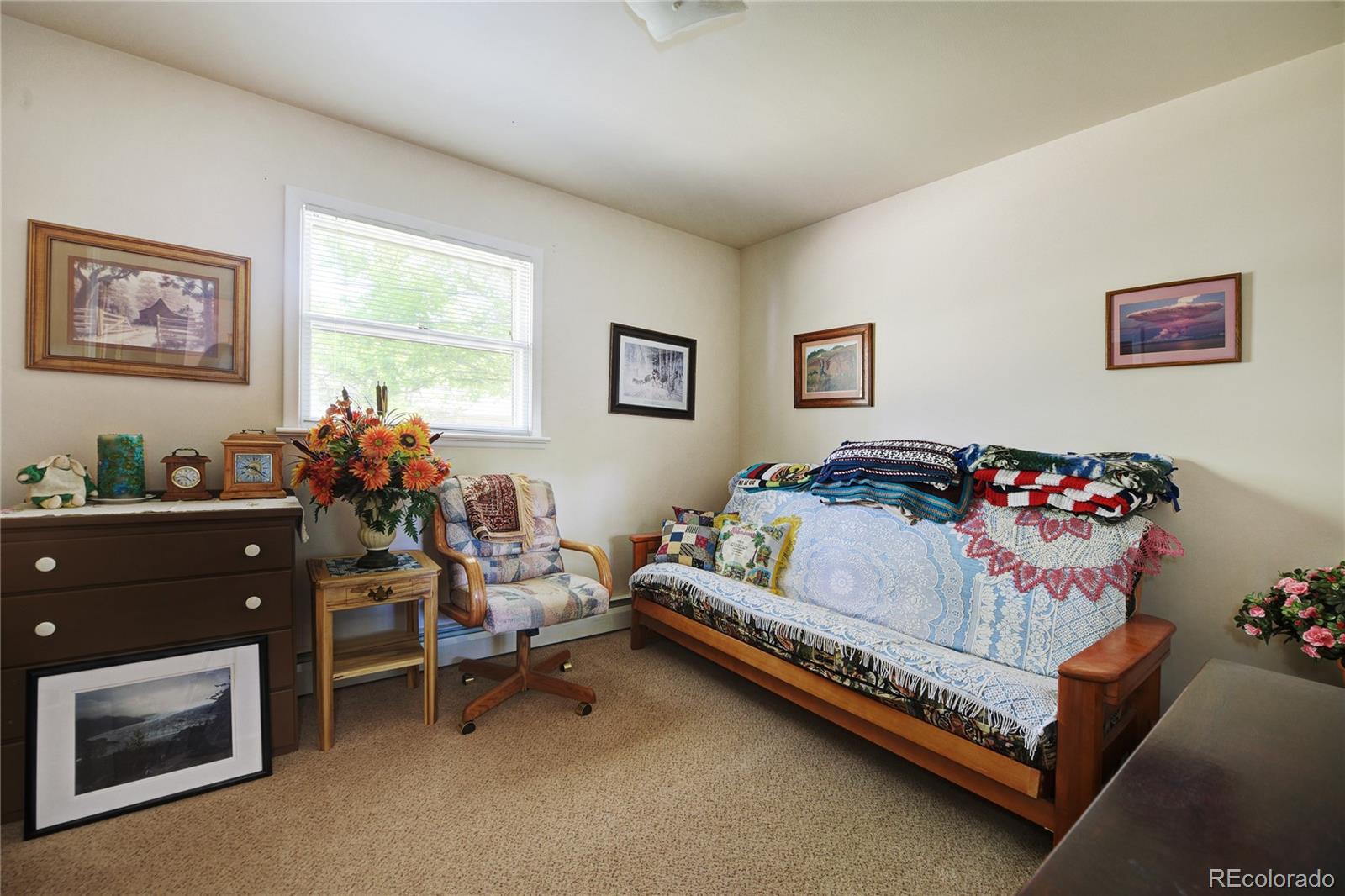 4405 Agate Road Boulder, CO 80304 - Photo 13 of 40 a bedroom with a bed and a dresser