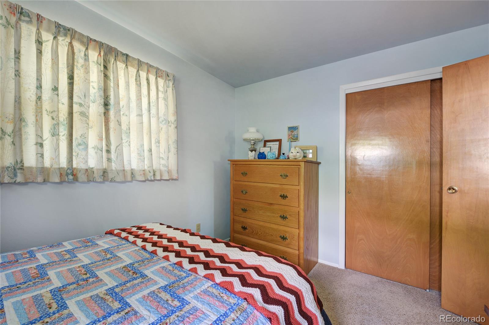 4405 Agate Road Boulder, CO 80304 - Photo 16 of 40 a bedroom with a bed and a dresser