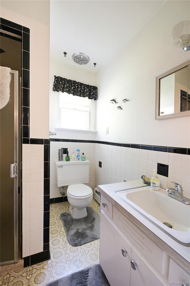 4405 Agate Road Boulder, CO 80304 - Photo 17 of 40 a bathroom with a sink a toilet and a mirror