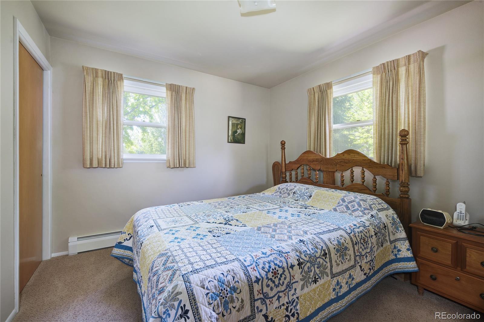 4405 Agate Road Boulder, CO 80304 - Photo 18 of 40 a bedroom with a bed and window