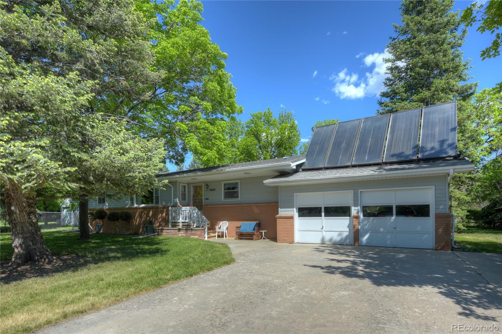 4405 Agate Road Boulder, CO 80304 - Photo 2 of 40 a front view of a house with garden