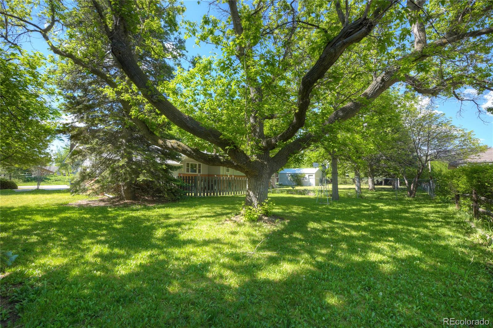 4405 Agate Road Boulder, CO 80304 - Photo 27 of 40 a big yard with lots of green space and fountain