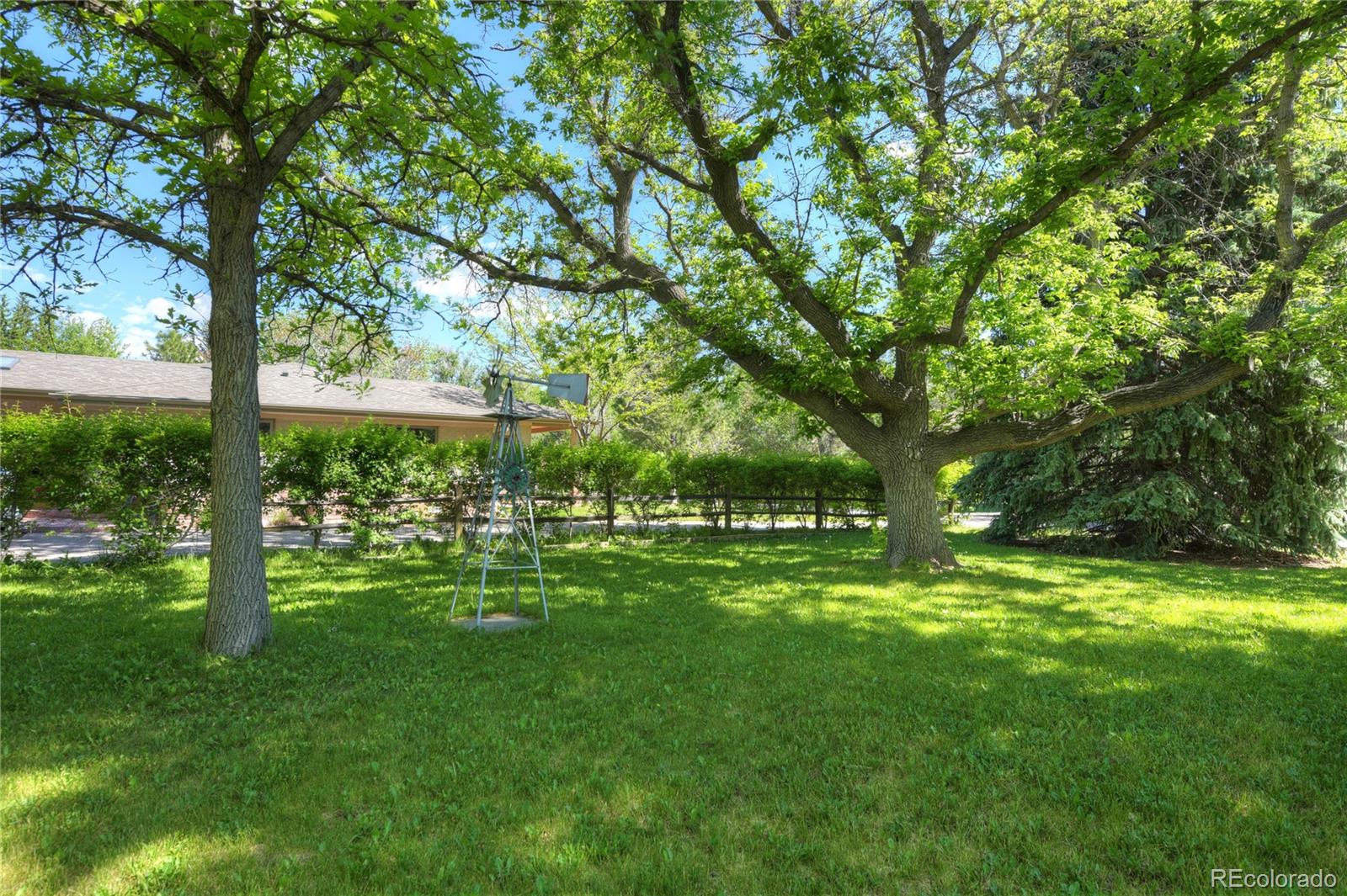 4405 Agate Road Boulder, CO 80304 - Photo 29 of 40 a yard with trees in the background