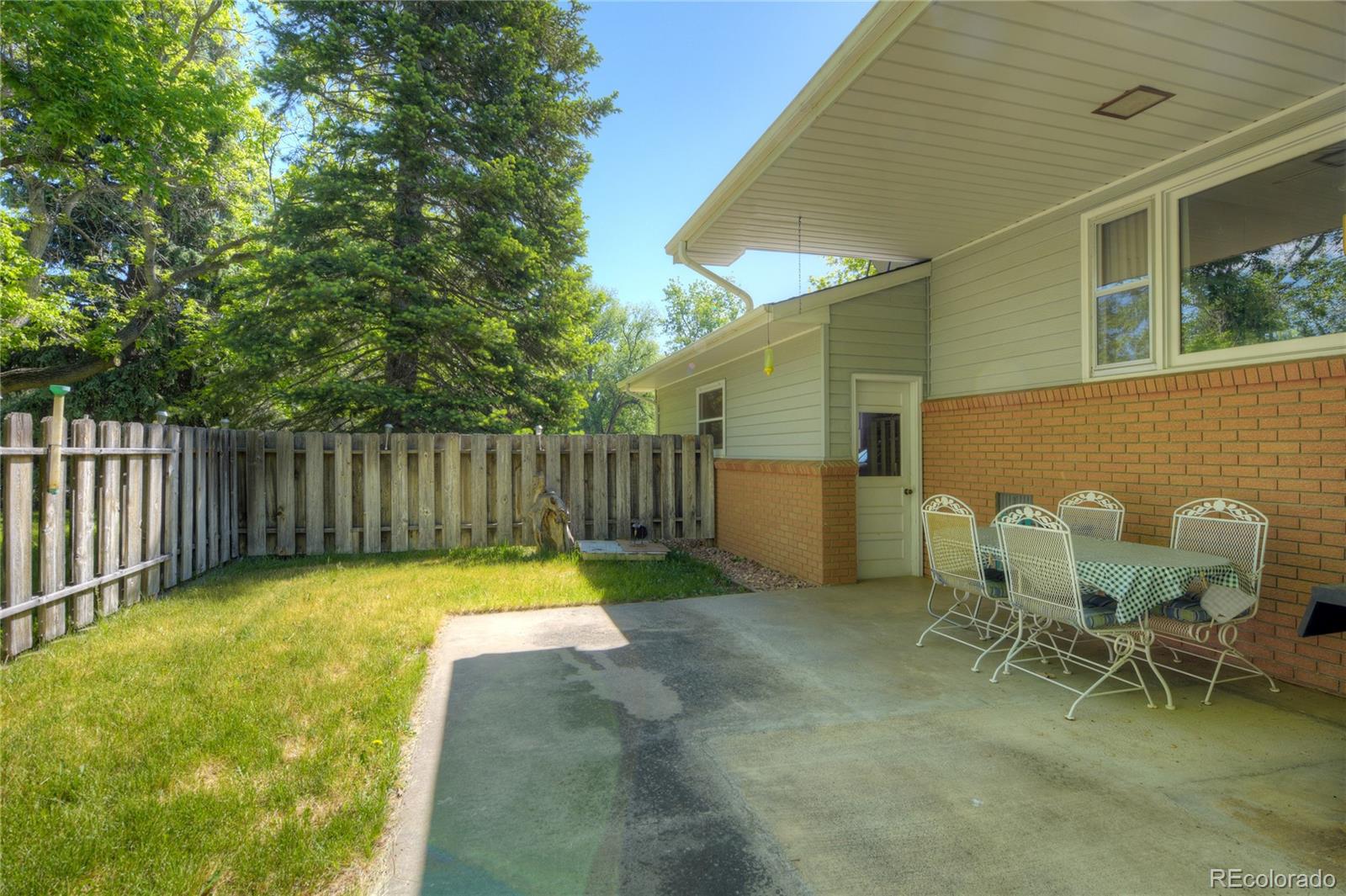 4405 Agate Road Boulder, CO 80304 - Photo 30 of 40 a view of a chairs and table in backyard
