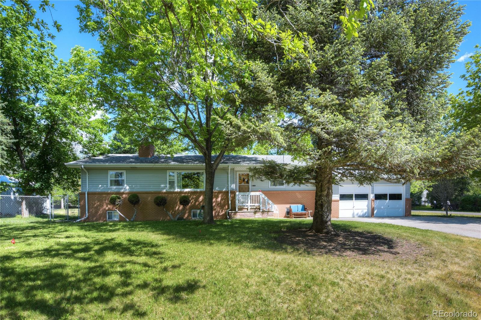 4405 Agate Road Boulder, CO 80304 - Photo 3 of 40 a front view of a house with garden
