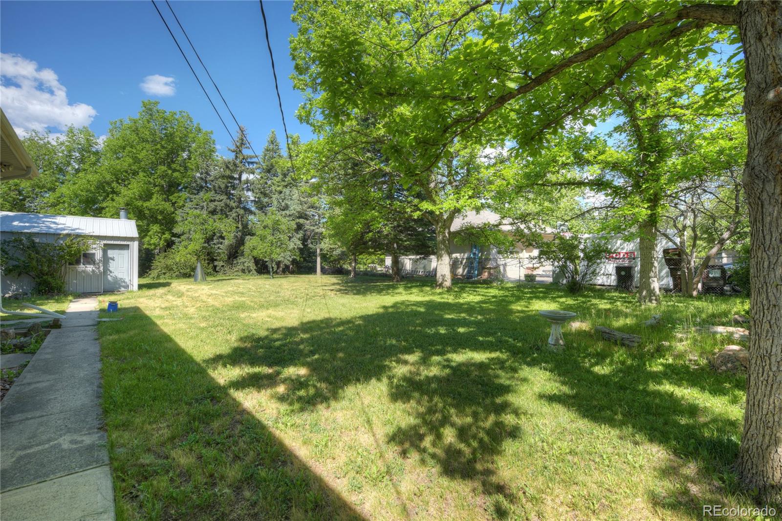 4405 Agate Road Boulder, CO 80304 - Photo 33 of 40 a view of a house with a yard