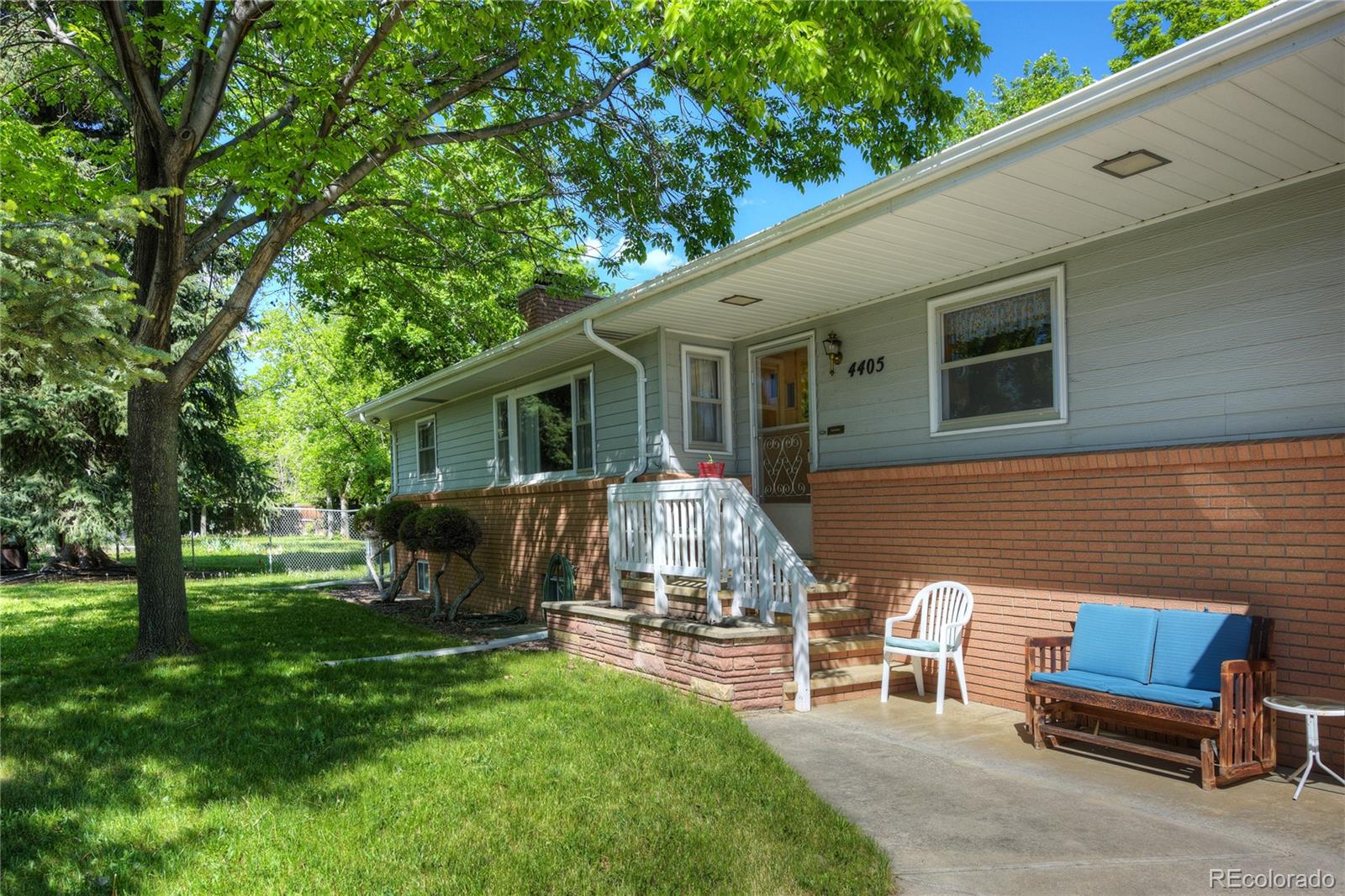 4405 Agate Road Boulder, CO 80304 - Photo 5 of 40 a view of a patio with table and chairs potted plants and a large tree