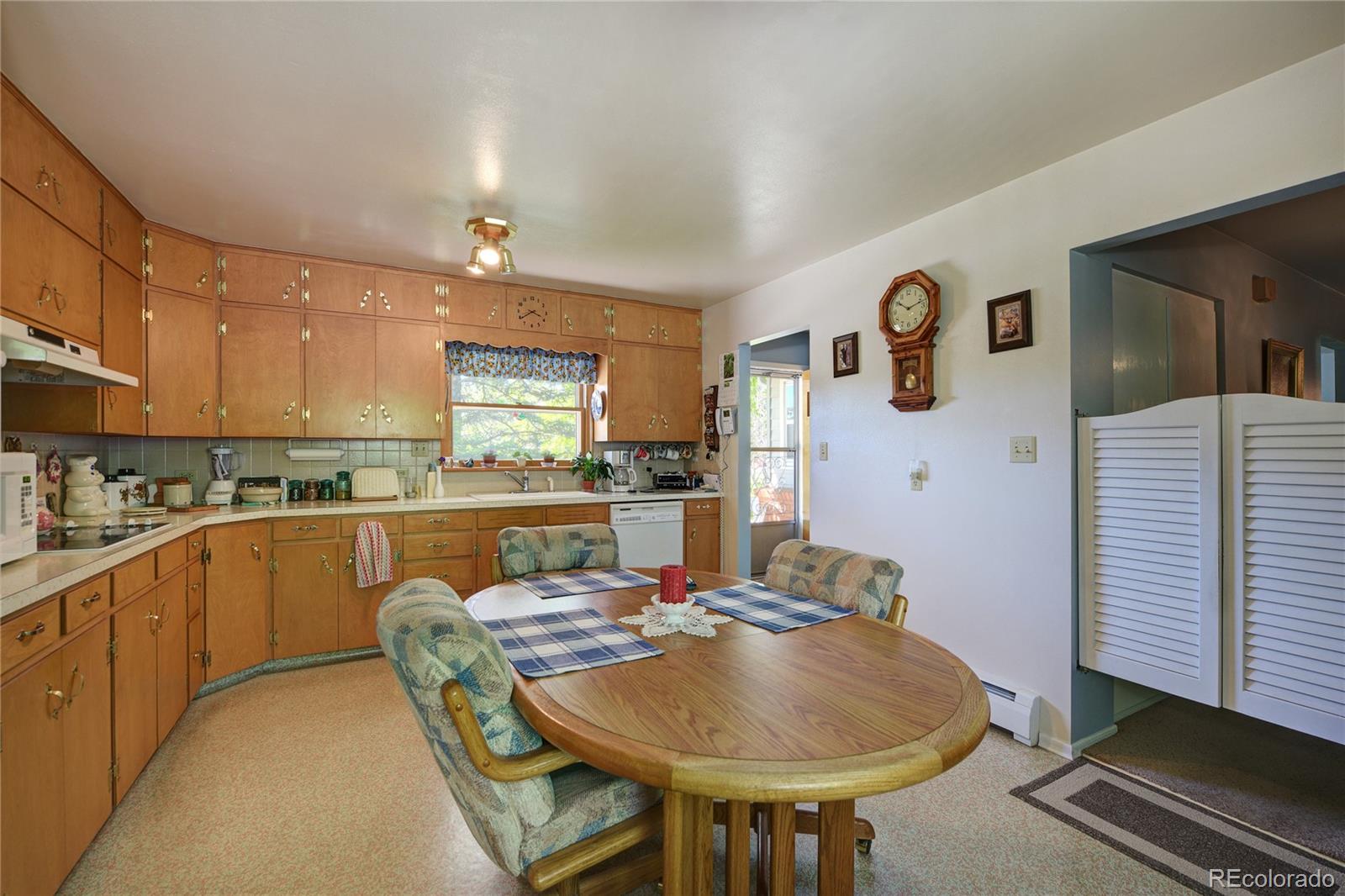 4405 Agate Road Boulder, CO 80304 - Photo 8 of 40 a kitchen with stainless steel appliances granite countertop a sink and cabinets