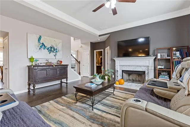 a living room with furniture and a fireplace