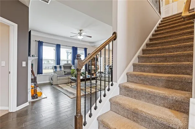 a view of entryway livingroom and hall with wooden floor