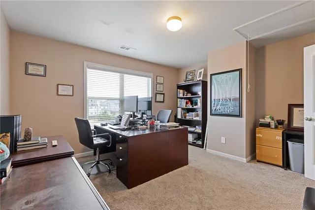 a living room with furniture and large window