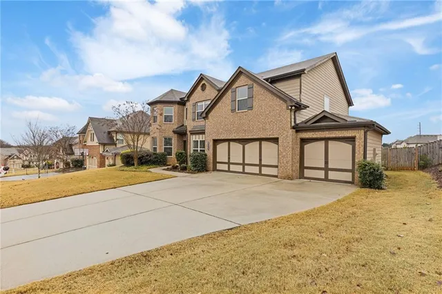 a view of multiple houses with a yard
