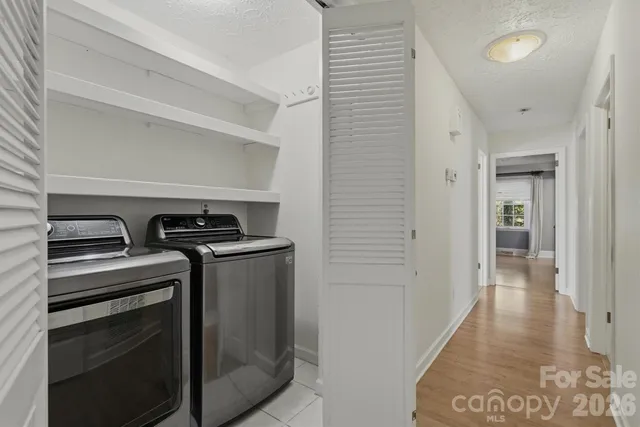 a view of a kitchen with a stove top oven