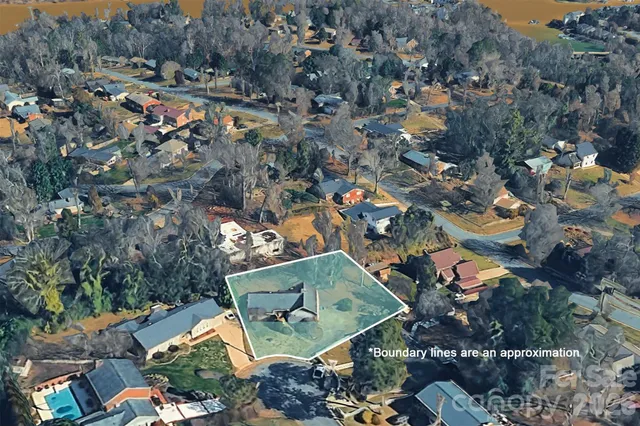 an aerial view of a house and outdoor space