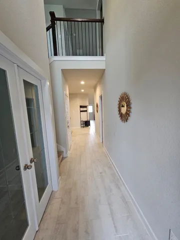 a view of a hallway view with staircase