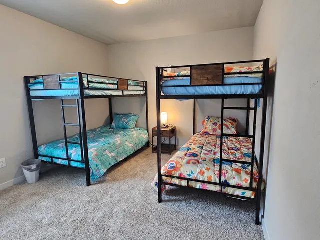 a bedroom with a bed and a mirror