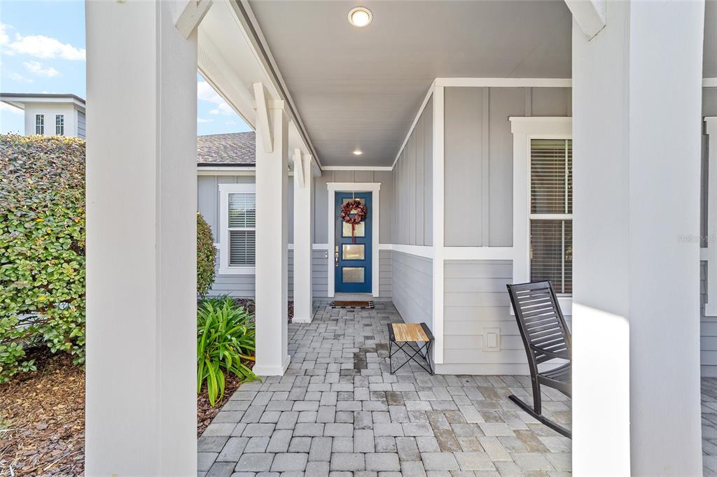 11895 Southwest 33 Lane Gainesville, FL 32608 - Photo 11 of 67 a view of an entryway with wooden floor and a potted plant