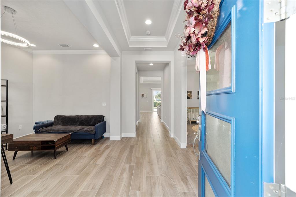 11895 Southwest 33 Lane Gainesville, FL 32608 - Photo 13 of 67 a living room with furniture and a fireplace