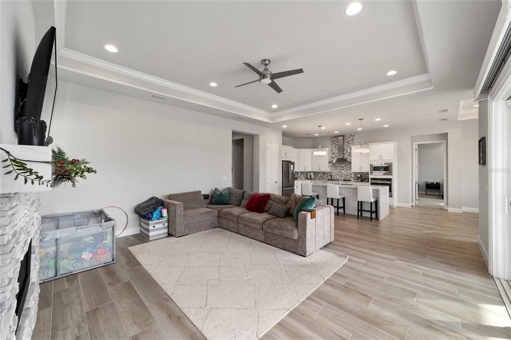 11895 Southwest 33 Lane Gainesville, FL 32608 - Photo 21 of 67 a living room with furniture and a flat screen tv