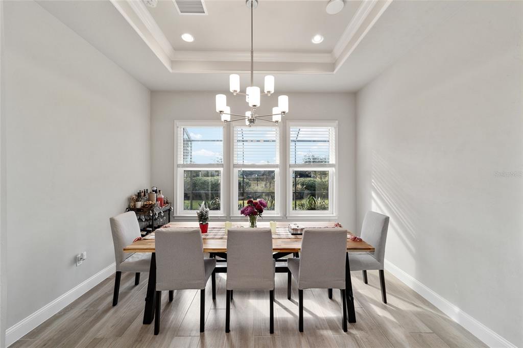 11895 Southwest 33 Lane Gainesville, FL 32608 - Photo 31 of 67 a view of a dining room with furniture window and outside view