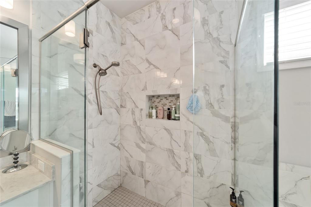 11895 Southwest 33 Lane Gainesville, FL 32608 - Photo 38 of 67 a bathroom with a sink shower and a mirror