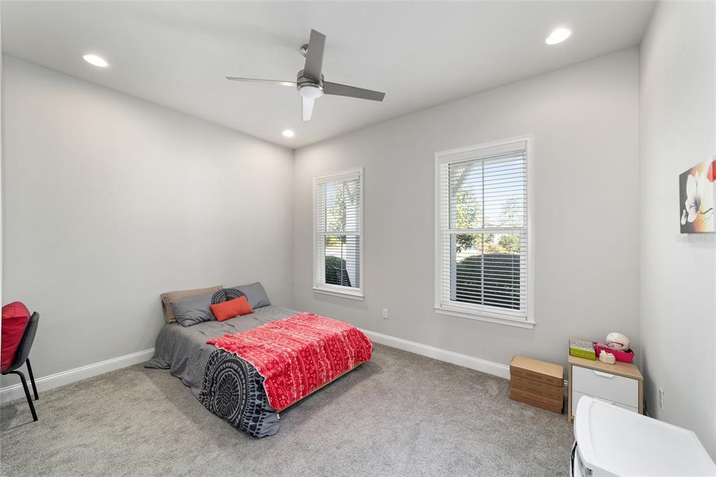 11895 Southwest 33 Lane Gainesville, FL 32608 - Photo 39 of 67 a bedroom with a bed dresser and a window