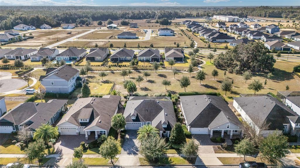 11895 Southwest 33 Lane Gainesville, FL 32608 - Photo 58 of 67 an aerial view of residential houses with outdoor space