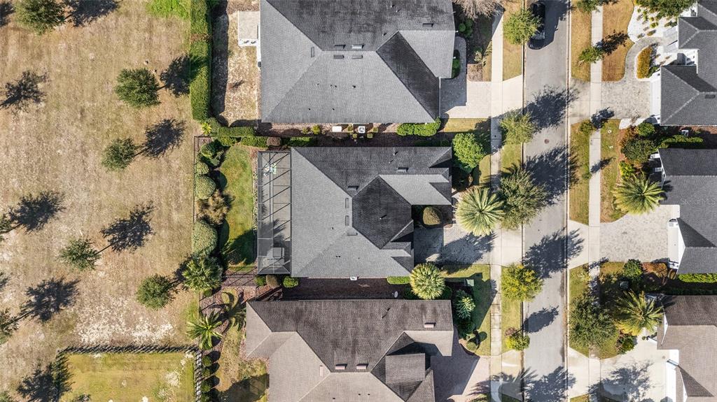 11895 Southwest 33 Lane Gainesville, FL 32608 - Photo 60 of 67 an aerial view of a house with a yard and a large tree