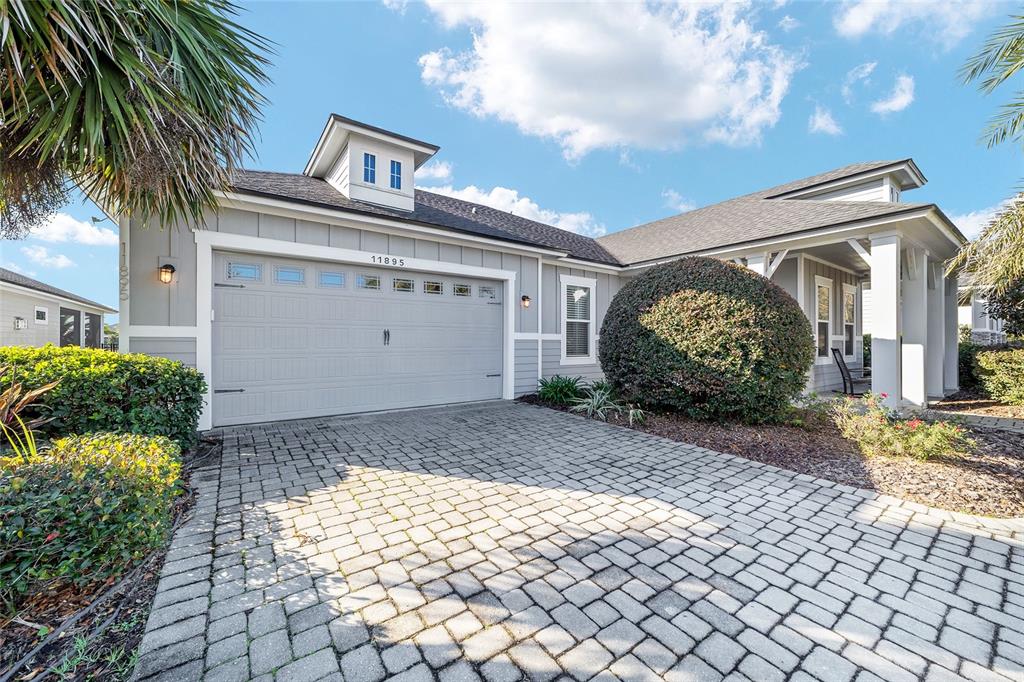11895 Southwest 33 Lane Gainesville, FL 32608 - Photo 9 of 67 a front view of a house with garden
