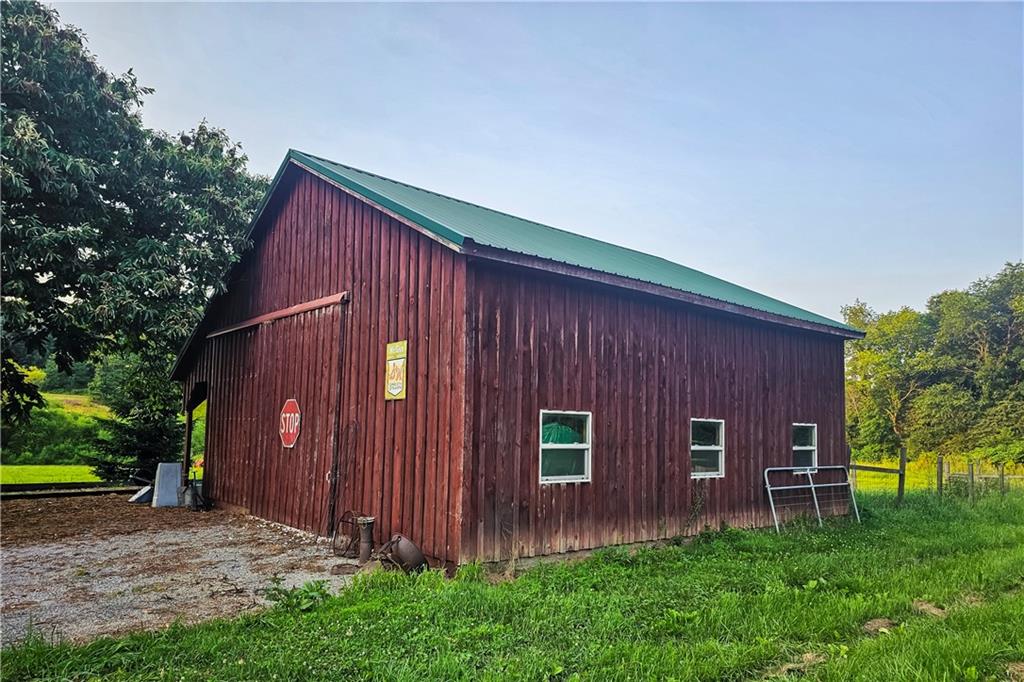 221 Mc Caughtry Run Road Darlington, PA 16115 - Photo 19 of 50 a view of backyard with potted plants and large tree