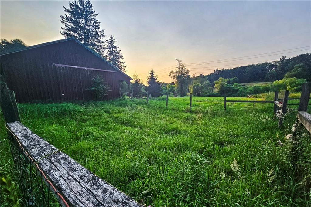 221 Mc Caughtry Run Road Darlington, PA 16115 - Photo 22 of 50 a view of a backyard with wooden fence