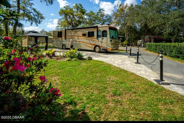 a house view with a sitting space and garden