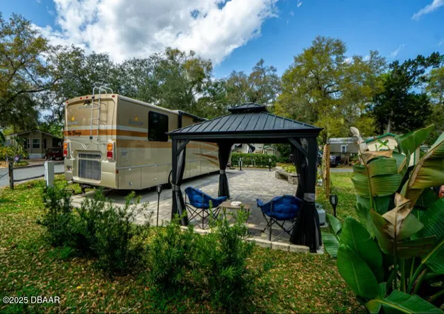 an outdoor view of house with green space