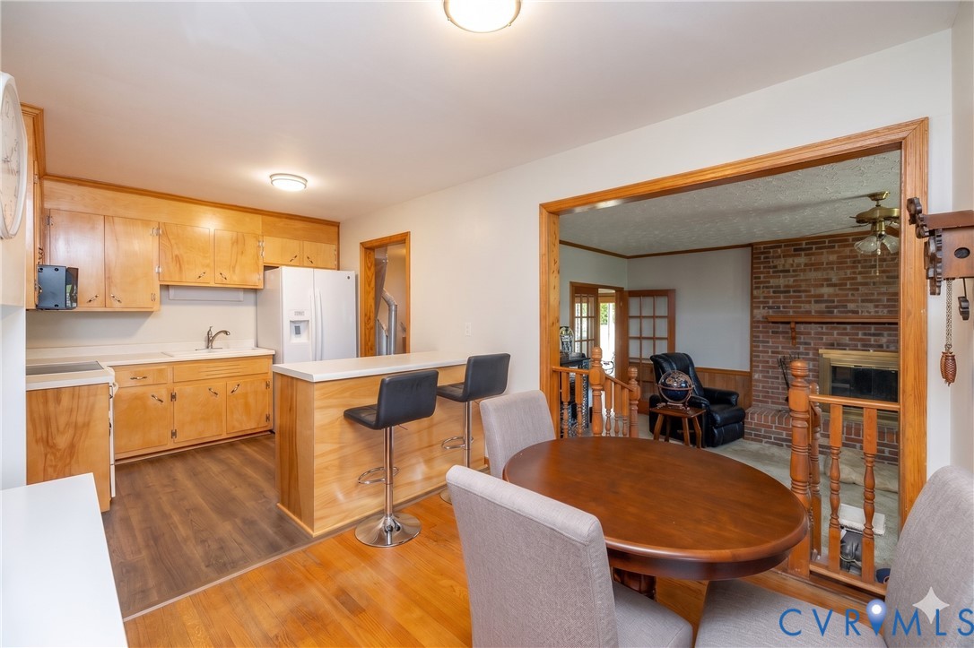 712 Keswick Road Colonial Heights, VA 23834 - Photo 12 of 34 a living room with furniture a dining table and chairs with kitchen view
