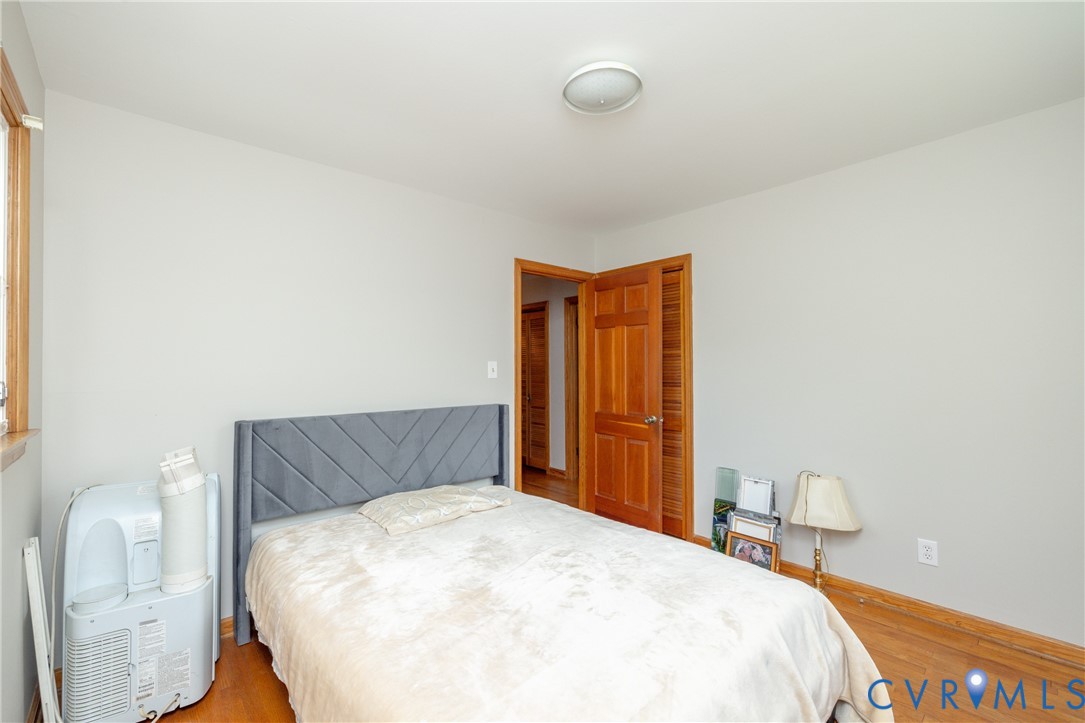 712 Keswick Road Colonial Heights, VA 23834 - Photo 21 of 34 a bedroom with a bed and wooden floor