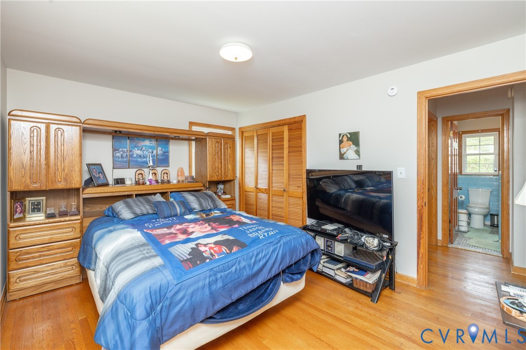 712 Keswick Road Colonial Heights, VA 23834 - Photo 24 of 34 a bedroom with a bed and a flat screen tv