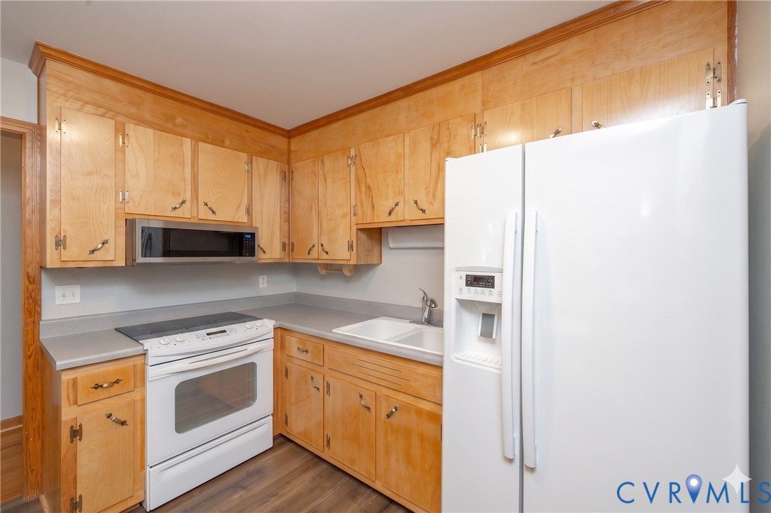 712 Keswick Road Colonial Heights, VA 23834 - Photo 9 of 34 a kitchen with stainless steel appliances white cabinets and a refrigerator