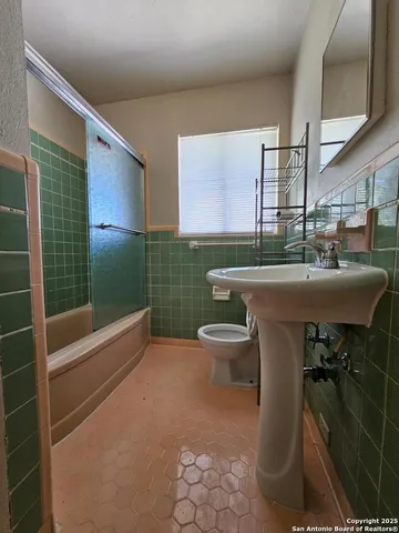a bathroom with a sink and mirror