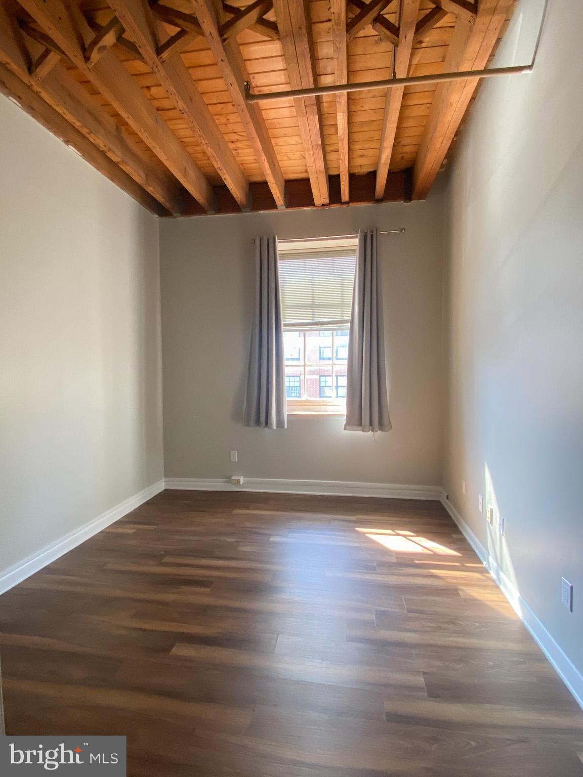 225 Arch Street Philadelphia, PA 19106 - Photo 9 of 13 a view of a room with wooden floor and windows