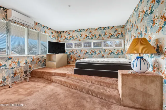 a living room with a couch and a flat screen tv