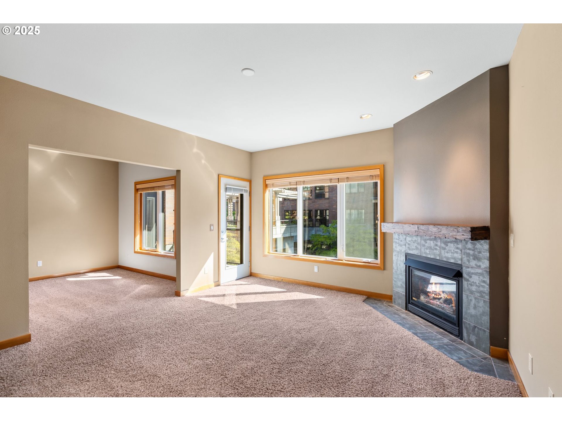 400 West 8th Street, Unit 236 Vancouver, WA 98660 - Photo 11 of 35 a view of an empty room with a fireplace and a window