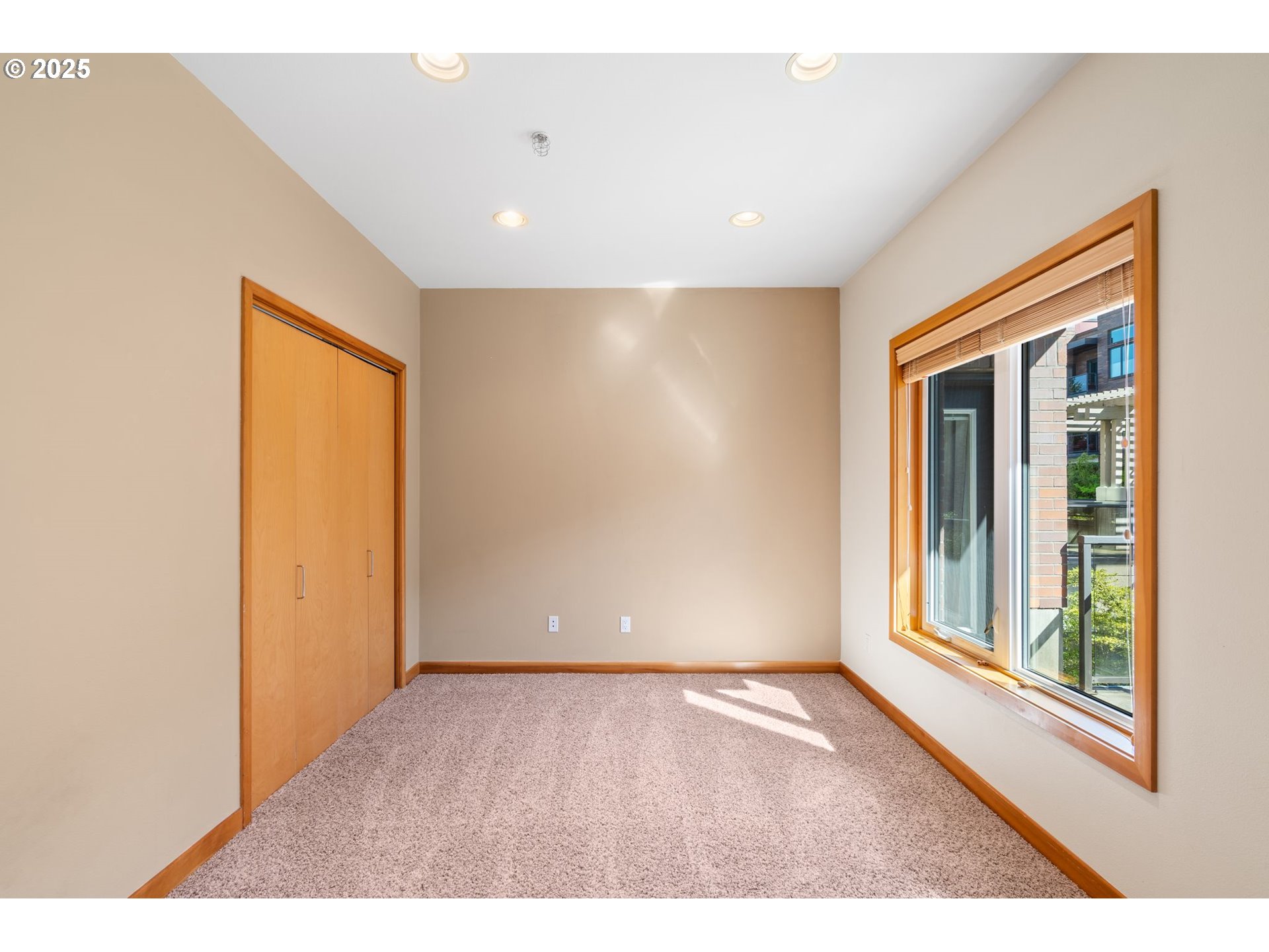 400 West 8th Street, Unit 236 Vancouver, WA 98660 - Photo 14 of 35 a view of an empty room with wooden floor and a window