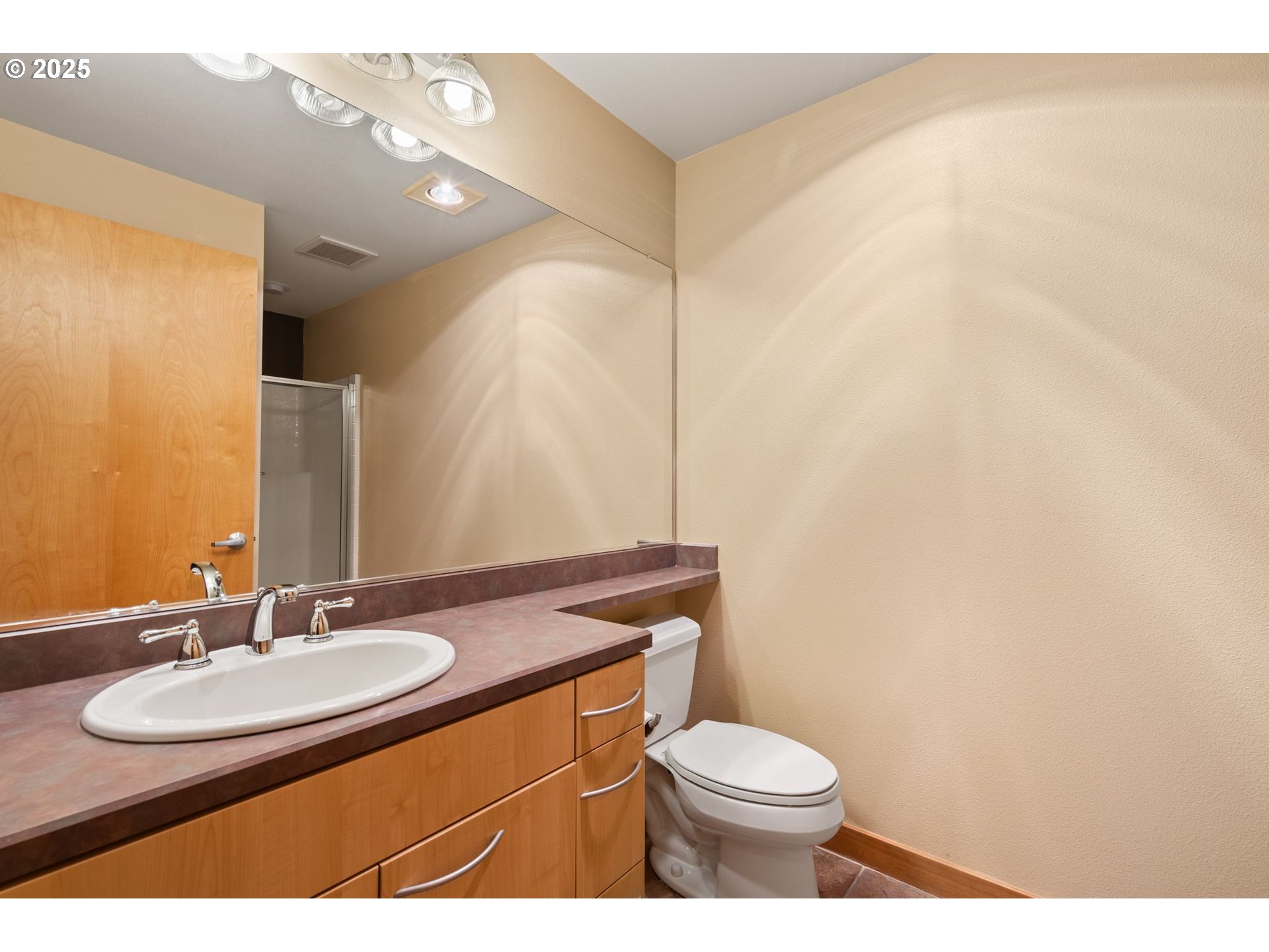 400 West 8th Street, Unit 236 Vancouver, WA 98660 - Photo 17 of 35 a bathroom with a sink a toilet and mirror