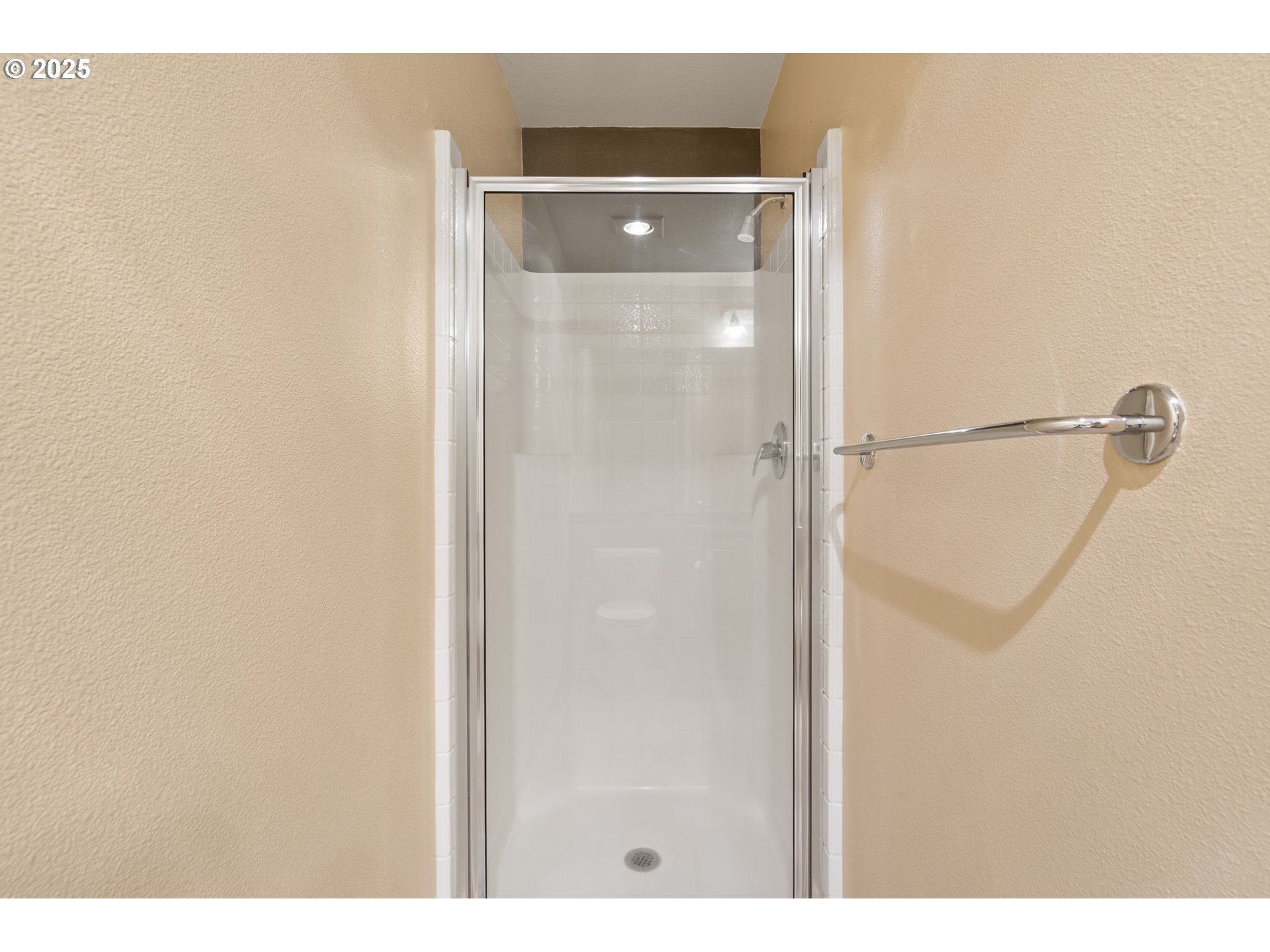 400 West 8th Street, Unit 236 Vancouver, WA 98660 - Photo 18 of 35 a bathroom with a glass shower door