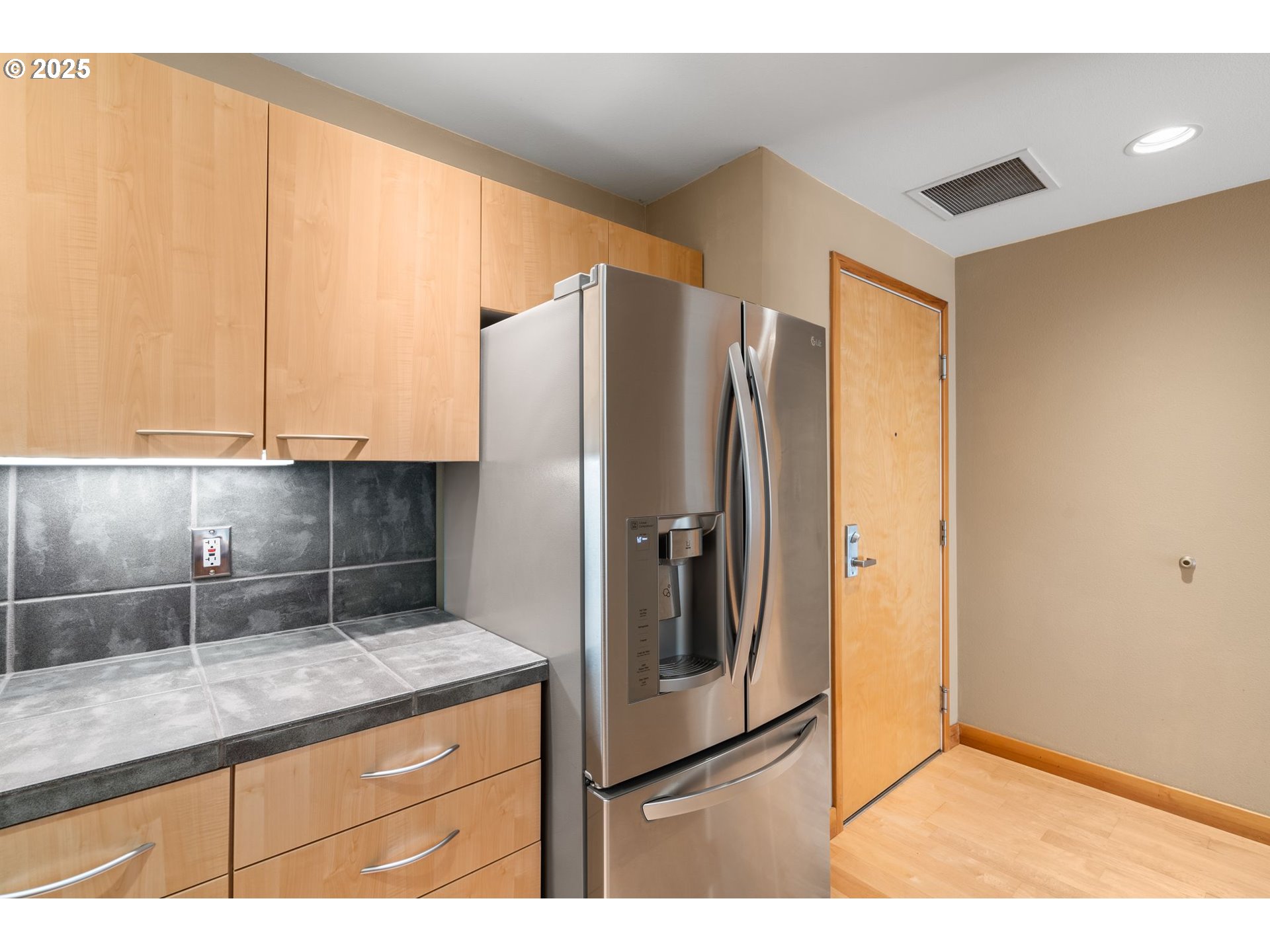 400 West 8th Street, Unit 236 Vancouver, WA 98660 - Photo 4 of 35 a kitchen with stainless steel appliances granite countertop a refrigerator and a sink