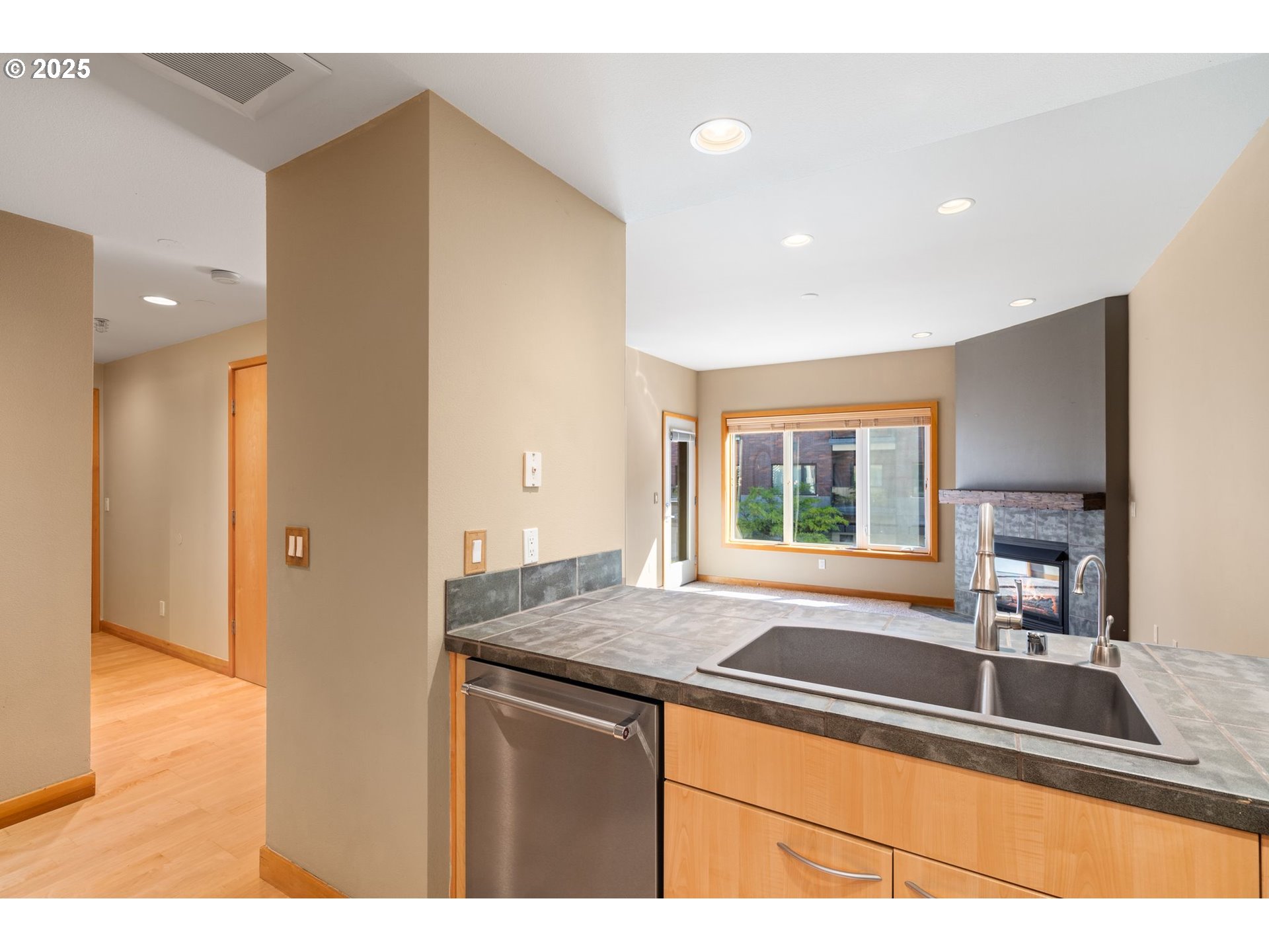 400 West 8th Street, Unit 236 Vancouver, WA 98660 - Photo 6 of 35 a kitchen with granite countertop a sink and a window