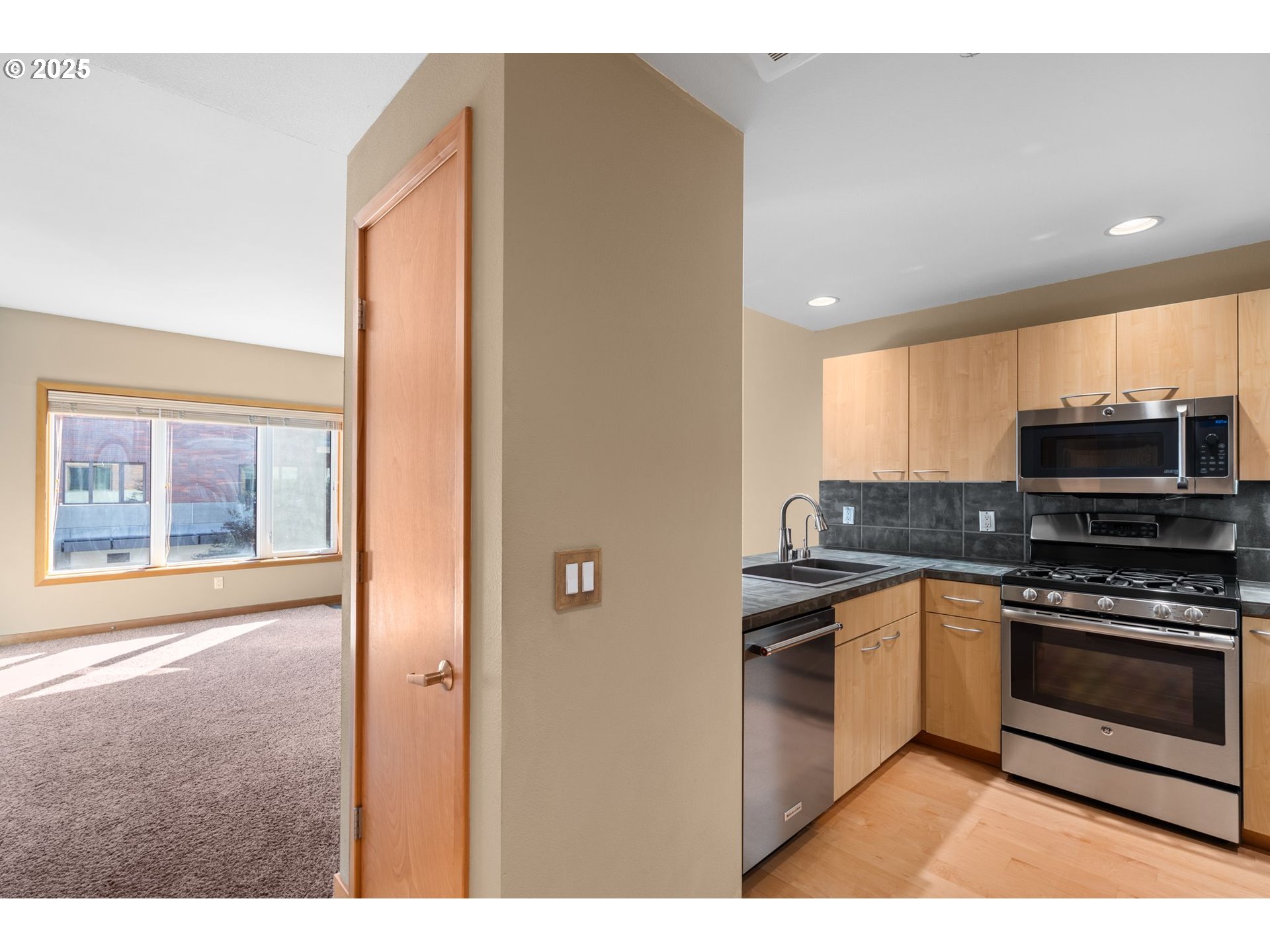 400 West 8th Street, Unit 236 Vancouver, WA 98660 - Photo 8 of 35 a kitchen with stainless steel appliances granite countertop a stove and a sink