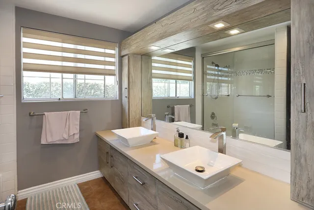 a view of bathroom with dual sinks